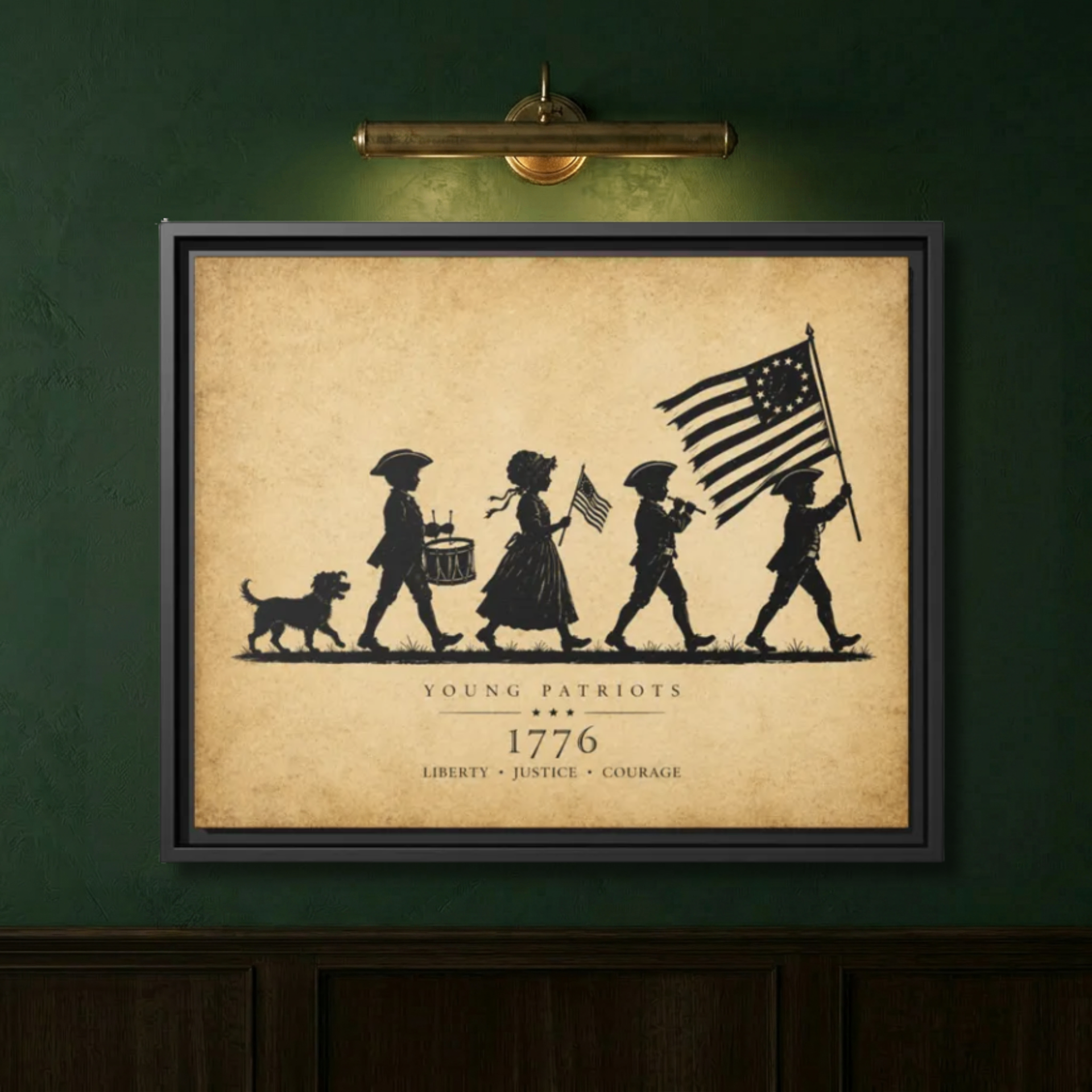 Close-up of the Young Patriots 1776 silhouette parchment canvas in a black floating frame on a deep sage green wall, lit by a brass picture light